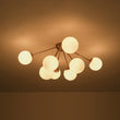 Load image into Gallery viewer, Brass 8-Light Milky Glass Globe Sunburst Semi Flush Mount
