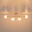 Load image into Gallery viewer, Minimalist White Glass Globe Linear 4-Light Sputnik Semi Flush
