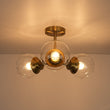 Load image into Gallery viewer, Farmhouze Light - Mid Century 3 - Light Clear Glass Globe Semi Flush Mount - Ceiling Light - Brass - 
