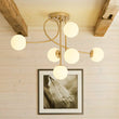 Load image into Gallery viewer, Farmhouze Light - Mid - Century Frosted Glass Globe Scroll Sputnik Ceiling Light - Ceiling Light - Brass - 
